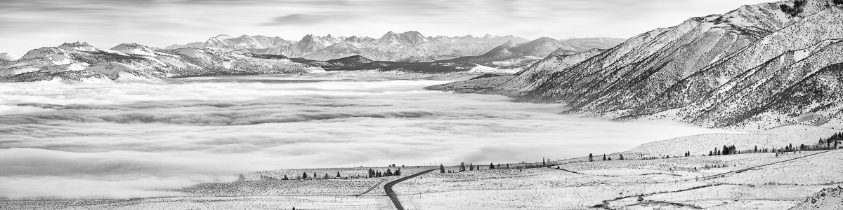 fog over mono lake with snow covered mountains