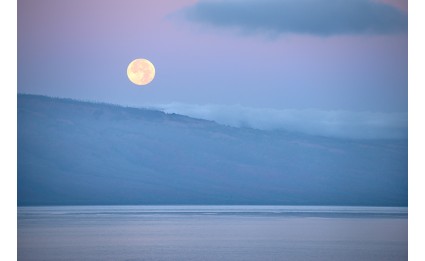 full moonset over island of lanai
