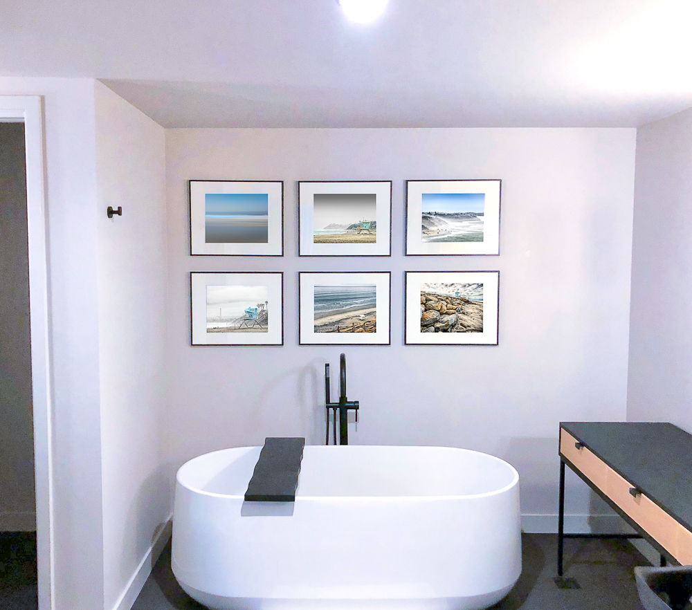 six 11x14 images on the wall at Alila Marea Beach Resort bathroom
