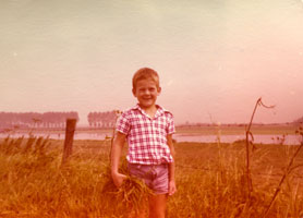 Roy Kerckhoffs as a young boy standing in a field in Geleen, The Netherlands.