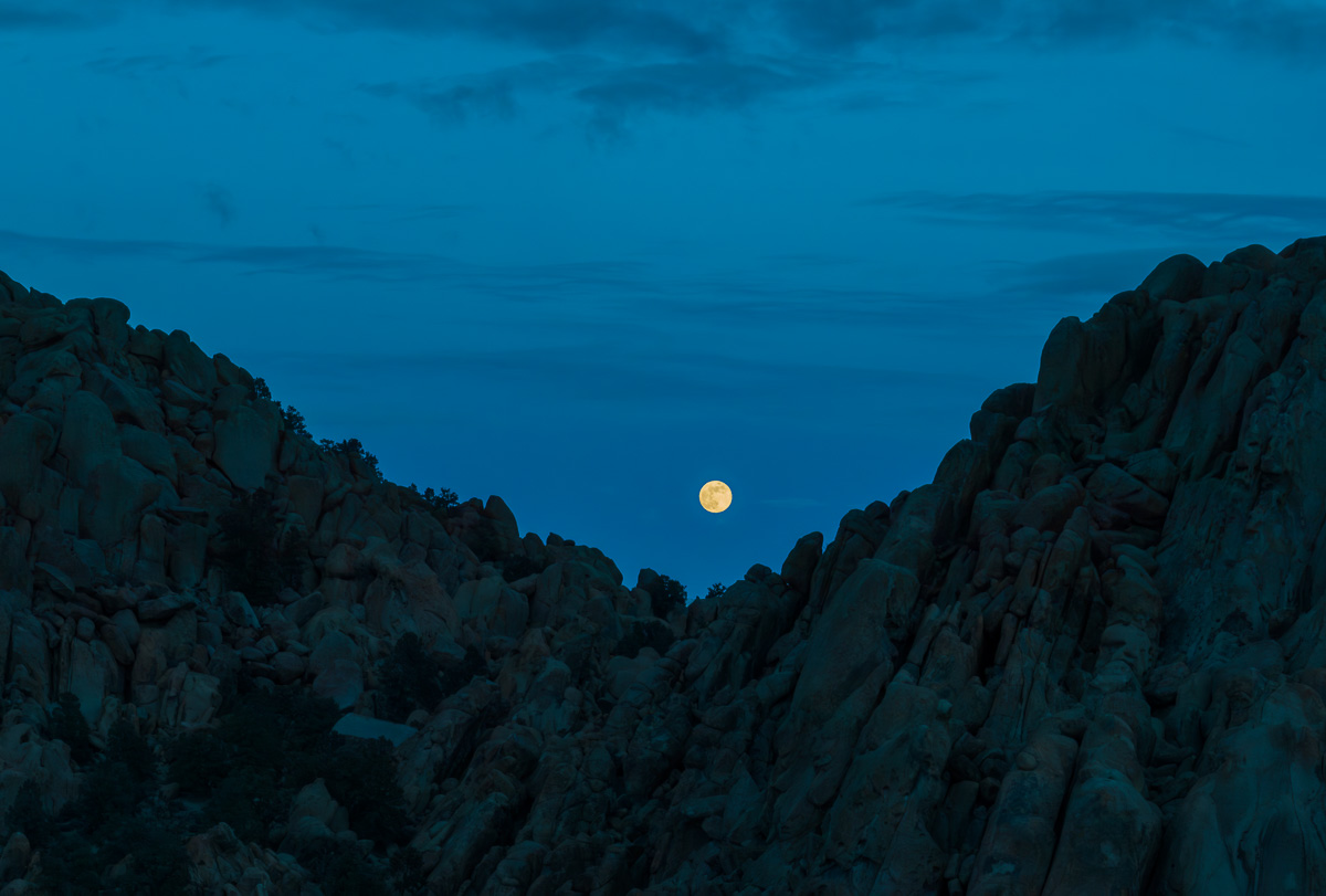 full moon between casa diablo mountain boulders