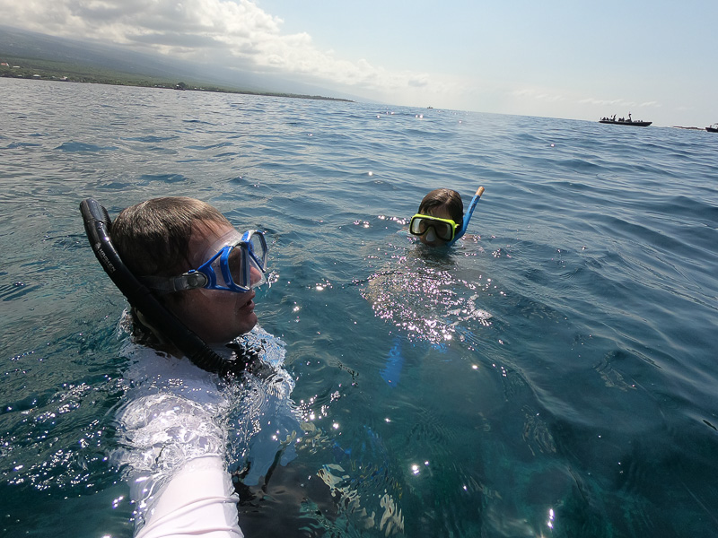 girl and man snorkeling in hawaii waters