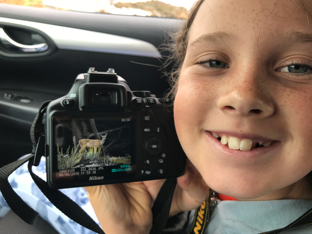 kate showing her first deer photo on her camera