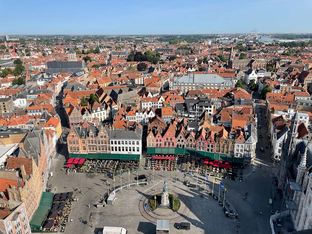 looking down at the bruges marketplace from belfry tower