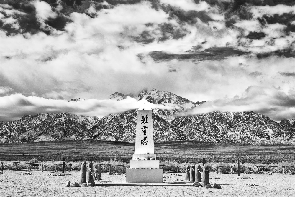 manzanar cemetery monument with eastern sierra mountains and clouds