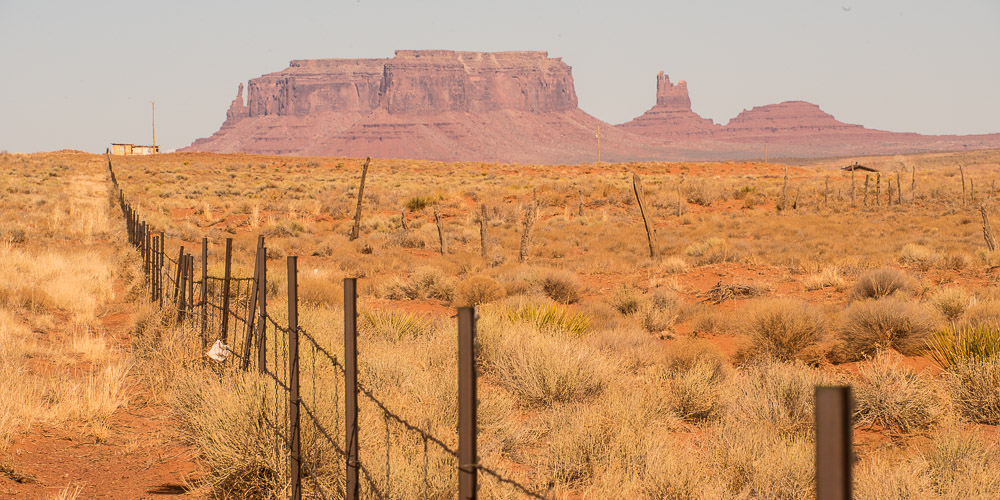 on the way to monument valley butte in background fence in foreground