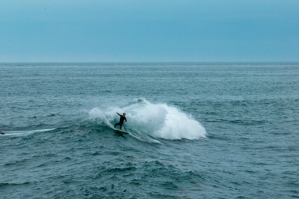 surfer on wave at windansea beach