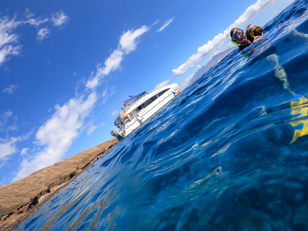 two snorkelers at molokini crater in maui hawaii
