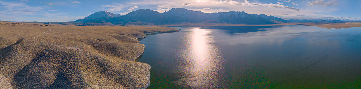 view of eastern sierra mountains with crowley lake in foreground